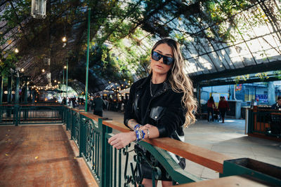 Portrait of young woman in sunglasses