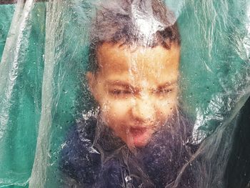 Close-up portrait of a woman in sea