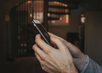 Close-up of hand holding smart phone