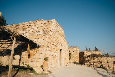 Old ruined building against clear blue sky