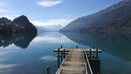 Pier over lake against sky