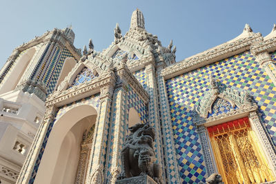 Low angle view of ornate building against sky