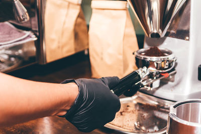 Midsection of man having coffee