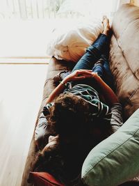 Woman with dog relaxing at home