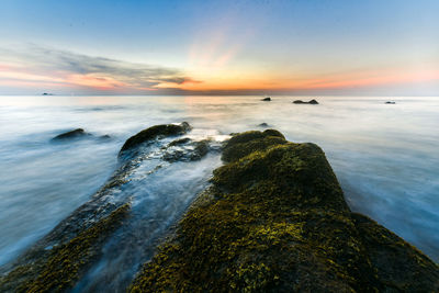 Scenic view of sea against sky during sunset