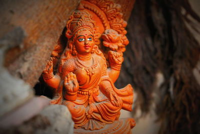 Close-up of statue against temple