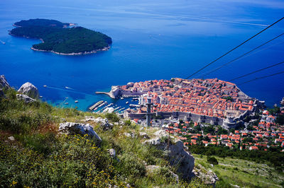 High angle view of townscape by sea