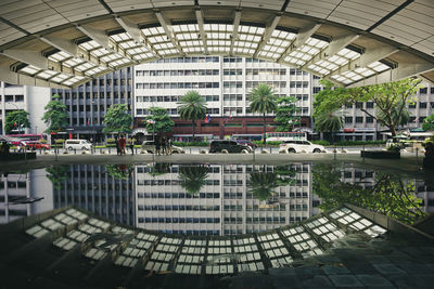 Reflection of building in swimming pool