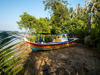 The fishing boat was stranded at the mouth of the river 