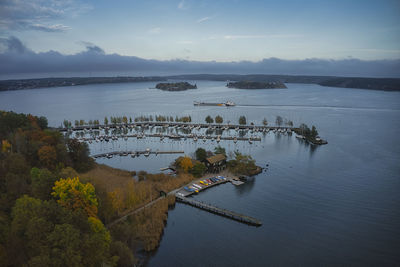 Scenic view of lake by trees against sky during autumn