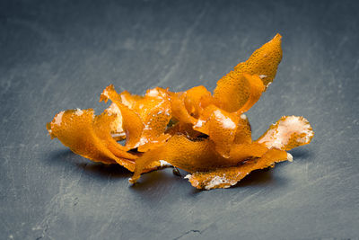 High angle view of orange leaf on table
