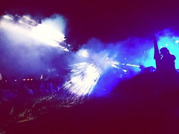 Firework display at night