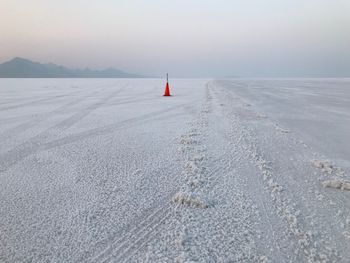 Landscape of salt flats and orange cone at the bonneville salt flats in utah