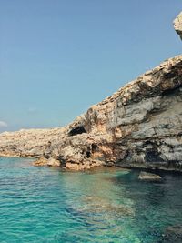 Scenic view of sea against clear blue sky