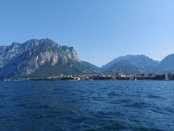 Scenic view of bay against clear blue sky