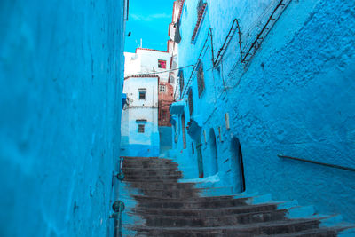 Narrow alley amidst buildings in city