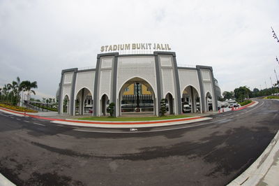 Panoramic view of road in city against sky