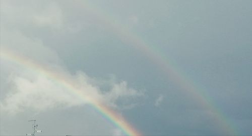 Low angle view of rainbow in sky