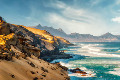 Scenic view of beach against sky