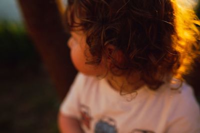 Close-up of boy in sunny day