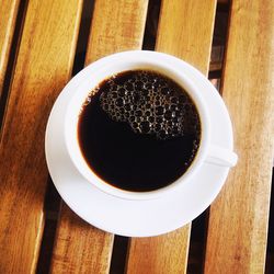 Directly above shot of coffee cup on table