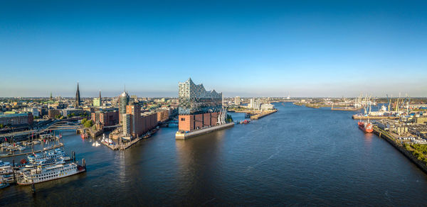 River in city against clear sky