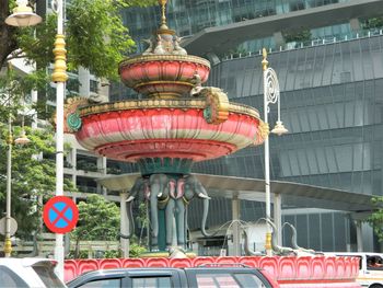 Red lanterns hanging by building in city