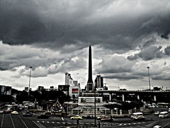 City street against cloudy sky