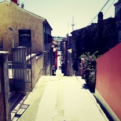 Narrow street along buildings