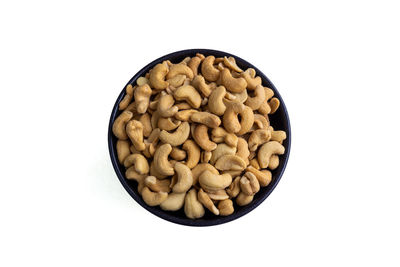 High angle view of bread in bowl against white background