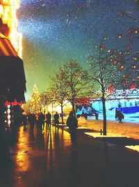 View of illuminated street lights at night