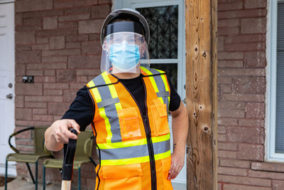 Full length of man working on wall