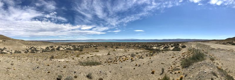 Scenic view of arid landscape against sky