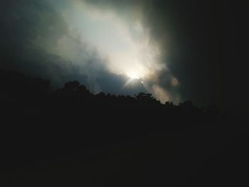 Silhouette landscape against scenic sky