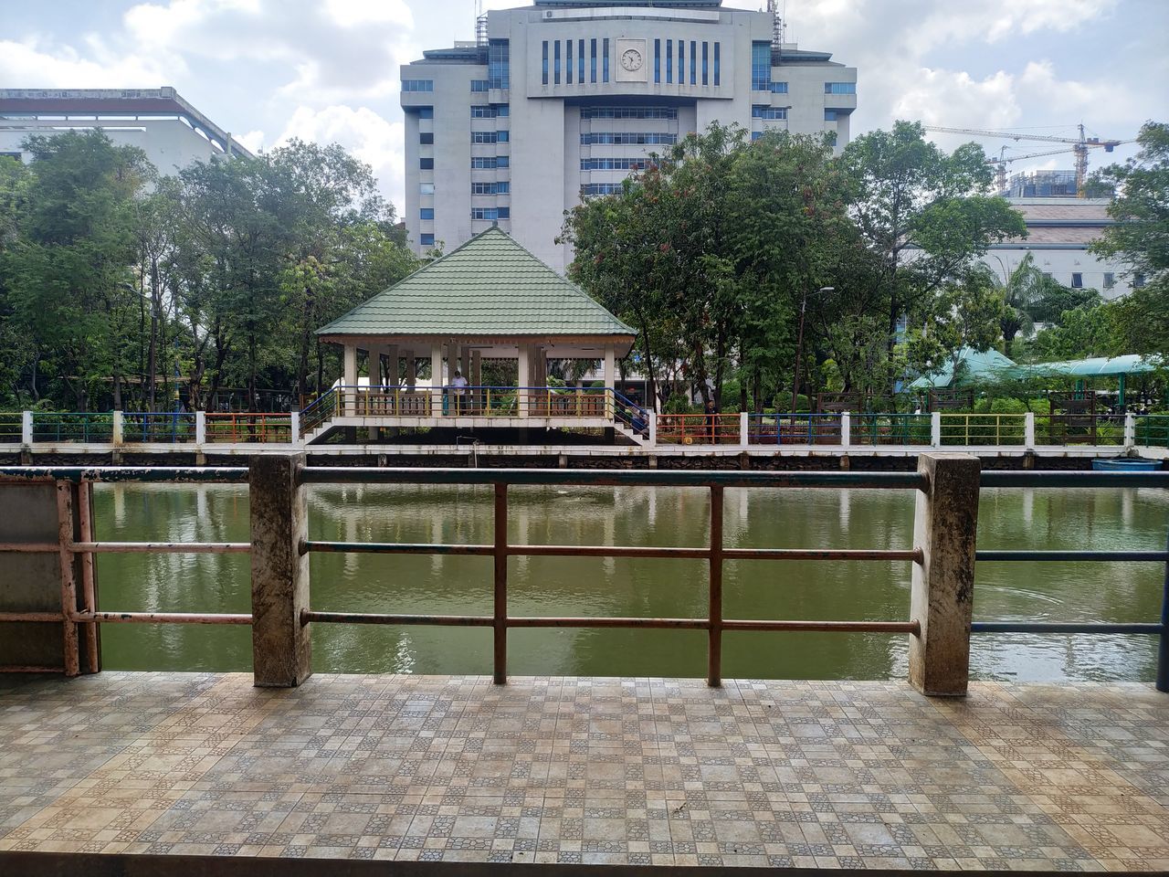 VIEW OF BUILDING WITH TREES IN CITY