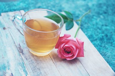 High angle view of roses on table by swimming pool