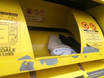 Close-up of yellow sign on bus