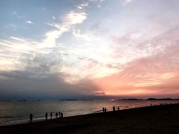 Scenic view of beach against sky during sunset