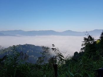 Scenic view of mountains against clear blue sky