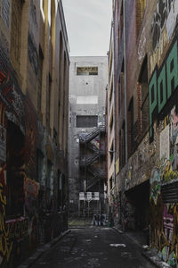 Narrow alley amidst buildings in city