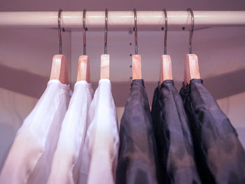 Close-up of clothes hanging on rack