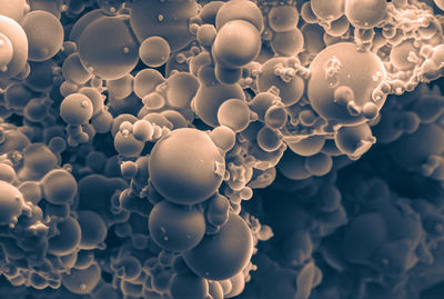 Sem image of silica microspheres at 2500x magnification, showing smooth, spherical particles.