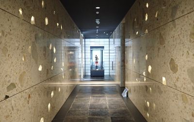 People walking in corridor of building