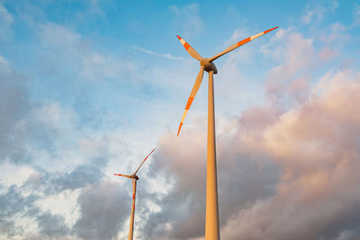 Low angle view of wind turbine against sky