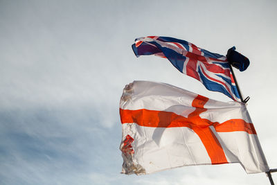 Low angle view of flag against sky