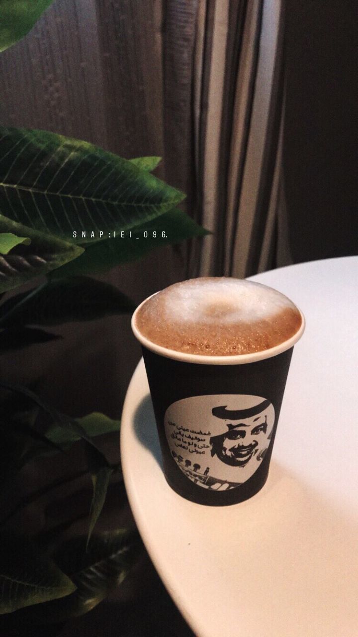 cup, mug, drink, refreshment, coffee, coffee cup, coffee - drink, food and drink, still life, indoors, leaf, plant part, table, no people, close-up, frothy drink, freshness, crockery, hot drink, high angle view, non-alcoholic beverage, latte, floral pattern