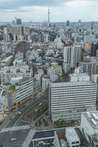 High angle view of modern buildings in city against sky