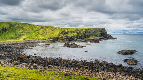 Rough coastline with cliffs of giants causeway, wild atlantic way, northern ireland