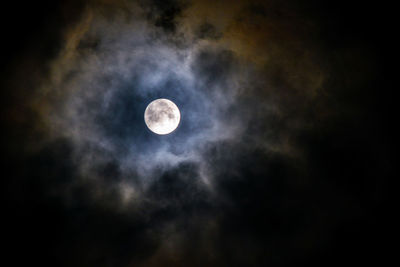 Low angle view of moon against sky at night