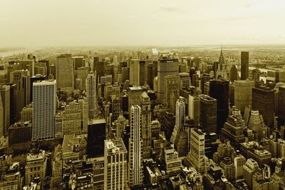 High angle view of modern buildings in city against sky